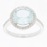 Blue aquamarine sterling silver ring with diamond accent, showcasing elegance and luxury.